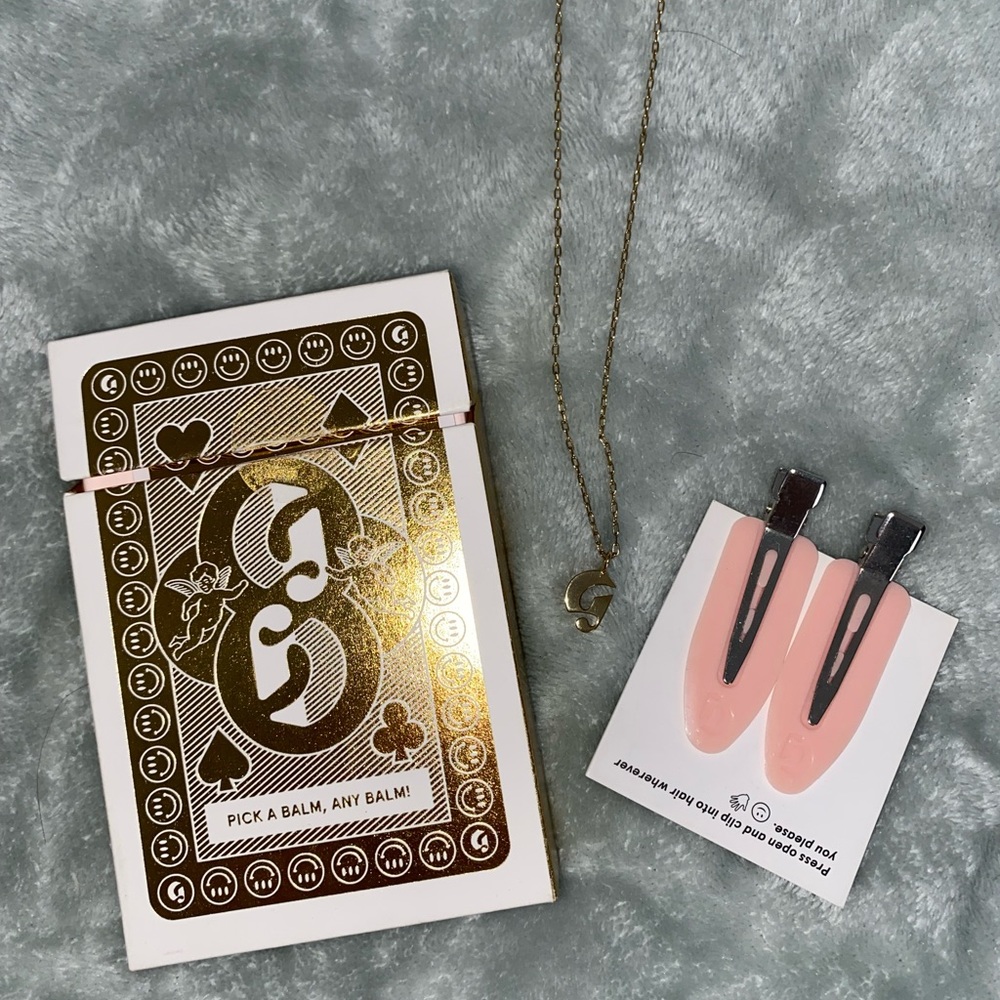 Lot of Glossier merch: Balm Dotcom Roulette, Hair Clips and Necklace
